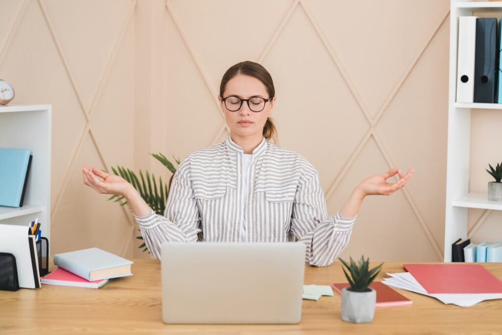 Businesswoman Meditating Yoga Practice On Workplace After Hard Day Deadline Concept Stress Relief 1024x683